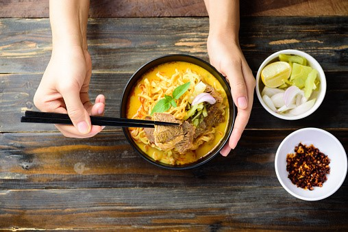 northern-thai-food-spicy-curry-noodles-soup-with-royalty